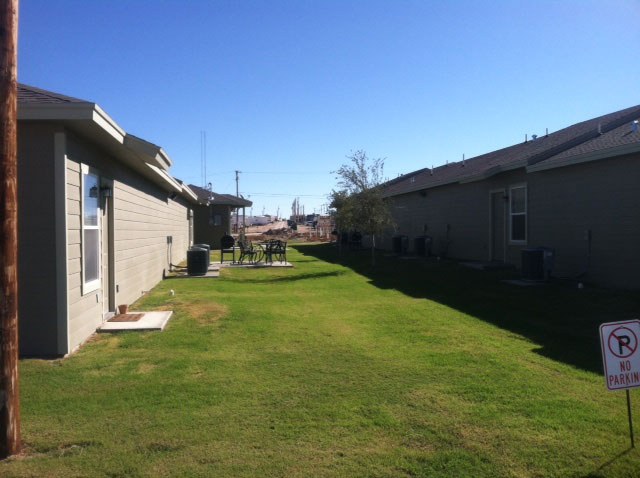 Lawn and apartment buildings at Santa Rita Homes