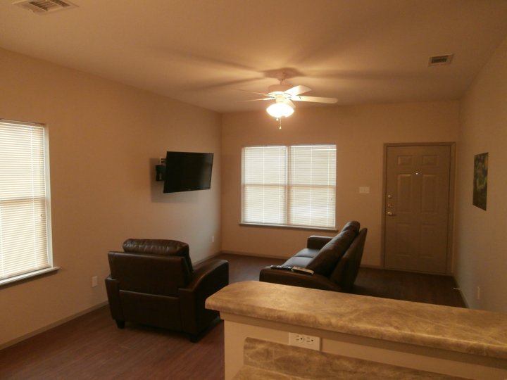 Living room with seating and television